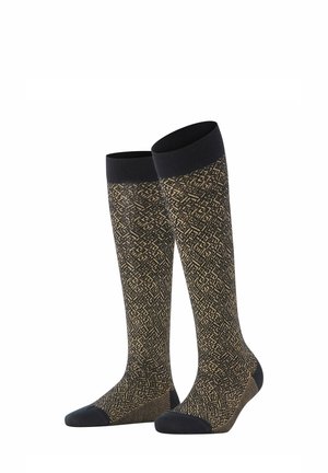 Paar knielange Socken mit schwarzen Bündchen, Zehen und Fersen, mit einem gold-schwarzen filigranen geometrischen Muster.