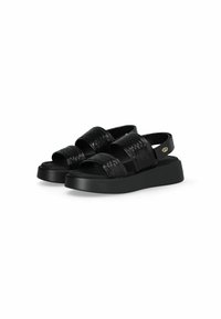 Sandales noires avec une semelle à plateforme, dotées de larges sangles tressées et d'une sangle arrière ajustable avec un petit accent logo. Texture lisse.