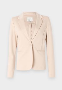 Veste beige cintrée en tissu lisse, avec col cranté, fermeture à un bouton et deux poches avant. Étiquette de la marque visible à l'intérieur.