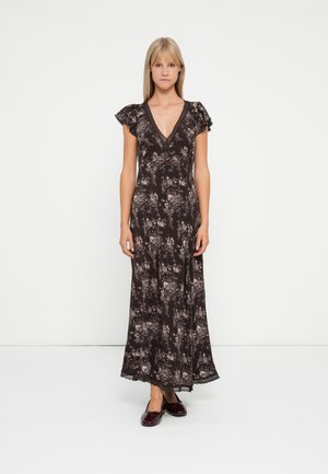 Black floral maxi dress with short ruffled sleeves, V-neck, lace trim, and a flowing silhouette. Worn with burgundy flats.