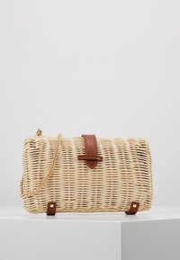 Woven straw handbag with a rectangular shape, leather accents, and a gold chain strap. The surface has a natural texture and light color.