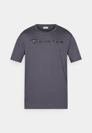 Graues Baumwoll-T-Shirt mit kurzen Ärmeln, versehen mit einem gestickten "Champion"-Logo auf der Brust und einem kleinen Logo am Ärmel.