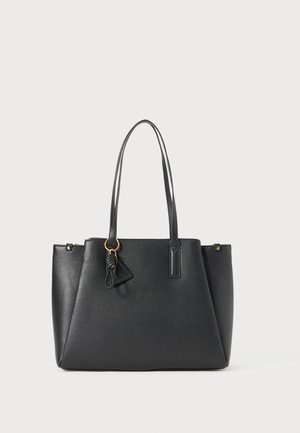 Black faux leather tote bag with dual handles, triangular charm, zipper closure, and a textured surface. Features gold-tone hardware accents.