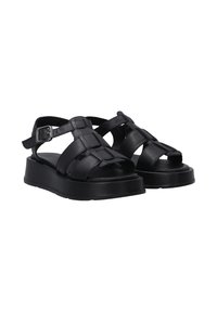 Schwarze Ledersandalen mit einem geflochtenen Design, offener Zehenseite und verstellbarem Knöchelriemen. Mit einer stabilen Plateausohle für Unterstützung.