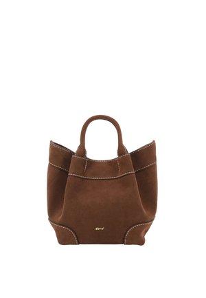 Brown suede tote bag with dual handles, white stitching accents, and small gold "abro" logo on front center.