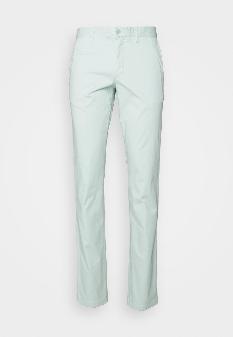 Světle mentolově zelené bavlněné kalhoty s rovným střihem nohavic, standardním pasem a zapínáním na přední knoflík. Mají hladkou texturu.