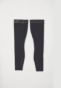 Svarta benvärmare i stretchigt material, med ett glansigt elastiskt band upptill och "Castelli" subtilt tryckt på sidan.