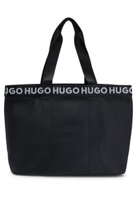 Borsa tote nera in nylon con ampio apertura superiore, dotata di due manici neri e una fascia con logo bianco "HUGO" lungo il bordo.