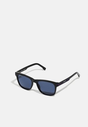 Black square-frame sunglasses with dark blue lenses. Features blue and red accents on the temples, made from a durable material.