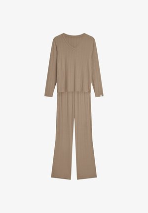 Beżowy dres z żebrowanej tkaniny, składający się z długiego rękawa topu z dekoltem w kształcie litery V i luźnym kroju, zestawiony z szerokimi spodniami. Przedni widok.