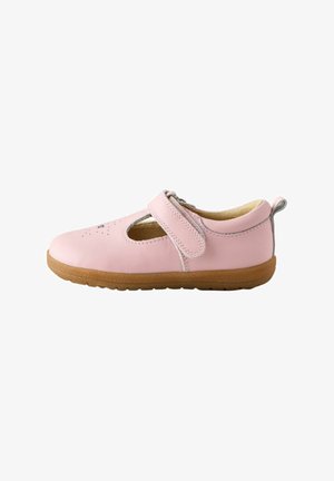 Soft pink children's shoe with brown rubber sole, Velcro strap, and small perforated heart design on top.
