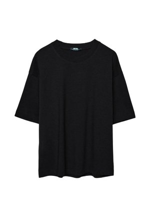 T-shirt nera oversize a maniche corte con scollo rotondo e vestibilità comoda, mostrata su sfondo bianco semplice.