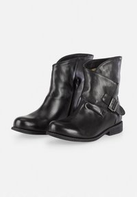 Black leather ankle boots with a rounded toe, side zipper, and a decorative buckle strap on the outer side. Flat rubber sole.