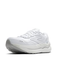 Chaussure de sport blanche avec une tige en cuir texturé, une semelle rembourrée et un design de semelle intermédiaire ondulée distinctif. Présente des lacets et un logo.