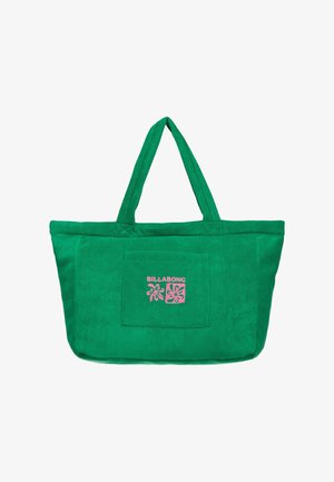 Sac fourre-tout en tissu doux vert avec deux poignées et une poche avant affichant le logo Billabong rose ainsi que des motifs floraux.