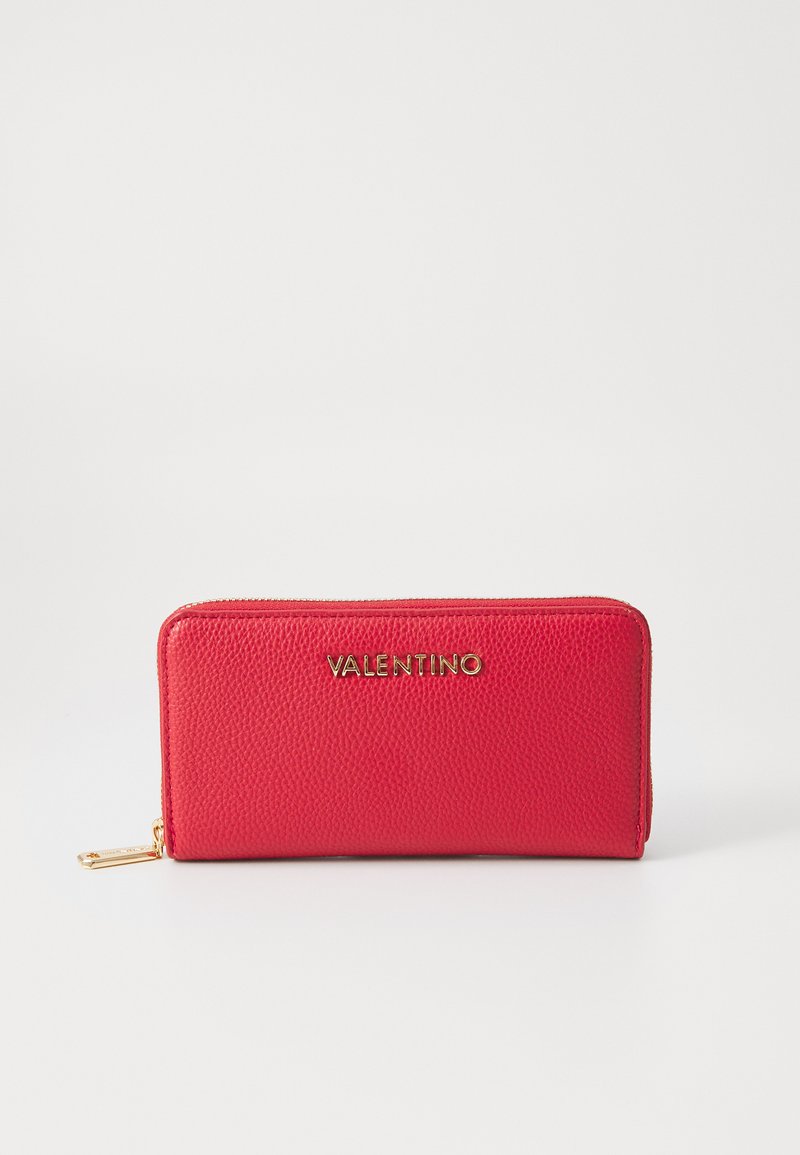 Red leather wallet with a textured finish, featuring a gold "VALENTINO" logo, zip closure, and a metal accent on the zipper pull.