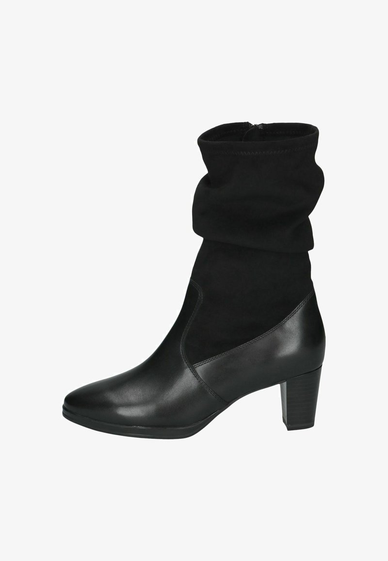 Botte noire mi-mollet pour femme avec une tige en tissu souple et une partie inférieure en cuir lisse, avec un bout arrondi et un talon bloc moyen.