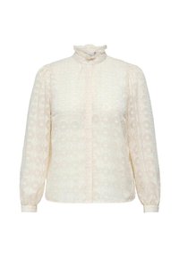 Blusa color crema con colletto alto a balze, maniche lunghe a sbuffo, sottile motivo geometrico e chiusura frontale con bottoni. Tessuto texturizzato.