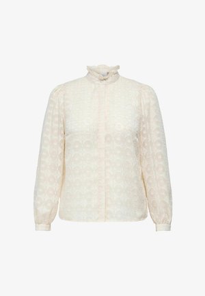 Kremowa bluzka z wysokim falbaniastym kołnierzem, długimi puffowymi rękawami, subtelnym geometrycznym wzorem i zapięciem na guziki z przodu. Teksturowany materiał.