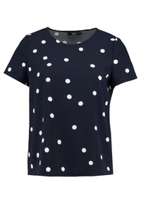 Marineblauw topje met korte mouwen en witte stippen. Ronde halslijn, losse pasvorm, lichtgewicht stof en een gladde textuur.