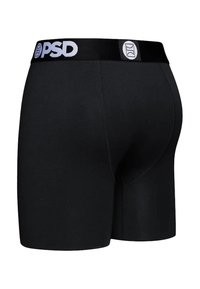 Melnas bokseršorti no gluda auduma ar platu elastīgu jostu, uz kuras baltā krāsā redzams "PSD" logotips. Vienkāršs un pieguļošs dizains.