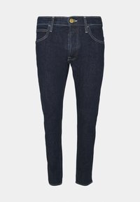 Ciemnoniebieskie jeansy o dopasowanym kroju, wykonane z denimu. Posiadają złote guziki, kontrastowe przeszycia oraz pięciokieszeniowy fason.