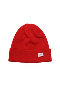 Red knitted beanie hat featuring a folded cuff and a small white label with text. Smooth texture and close-fitting design.