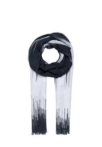 Écharpe noire et blanche en tissu doux et léger. Présente un design abstrait avec des motifs linéaires et des bords frangés.