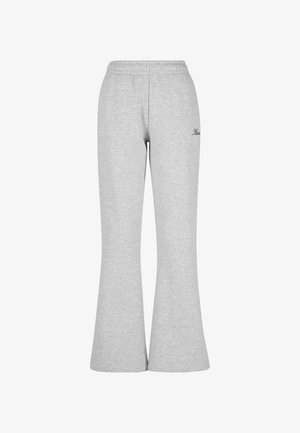 Hallid hallid säravad dressipüksid, mis on valmistatud pehmest puuvillasegust. Omavad elastset vööd ja väike must logo vasakul küljel.