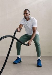Nike Performance UNLIMITED PANT - Treningo apatinė dalis - vintage green/black