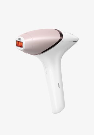 Dispositivo per la rimozione dei peli Philips con un corpo in plastica rosa e bianco, una finestra luminosa rettangolare e pulsanti di controllo sul manico.