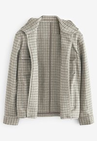 Houndstooth-mønstrede jakke i beige og brune nuancer, lavet af struktureret stof, med lynlåslukning og to frontlommer.