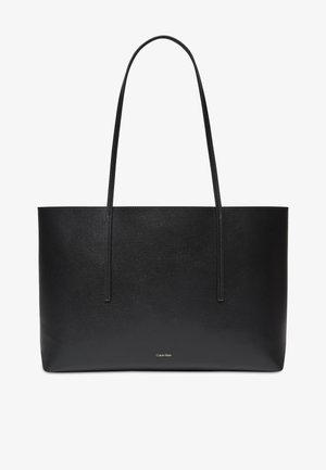 Black rectangular leather tote bag with two long handles and a small white Calvin Klein logo centered near the bottom.
