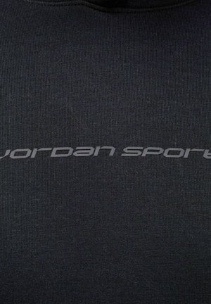 Zwarte pullover sweater van gestructureerde stof met een opvallend grijs "jordan sport"-logo aan de voorkant.