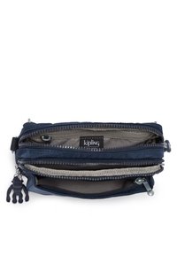 Kipling zippered wallet in navy blue, featuring multiple compartments, gray inner lining, and a black monkey keychain accent.