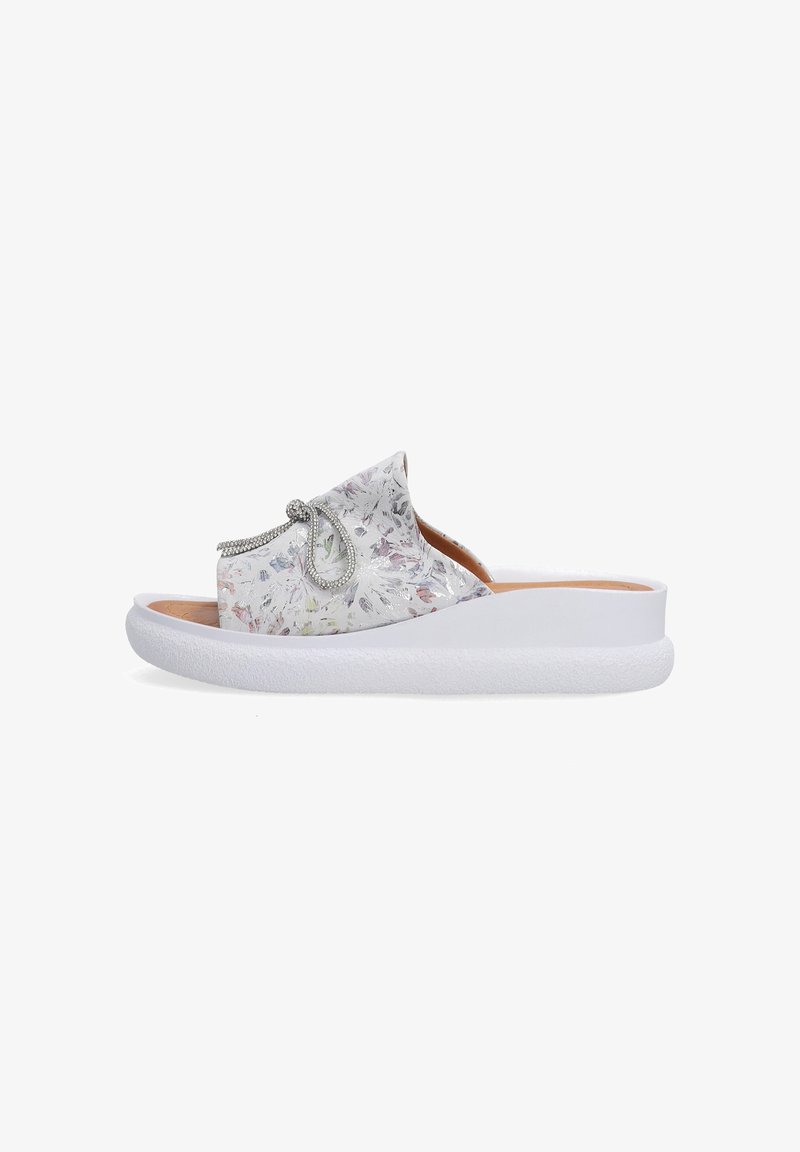 Slide sandal with a floral patterned upper in shades of white, pink, and green, featuring decorative rhinestone accents and a white sole.