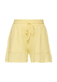 Shorts en tricot jaunes avec une taille élastique et un cordon de serrage, dotés de deux poches latérales et d'un design en tissu texturé à côtes.