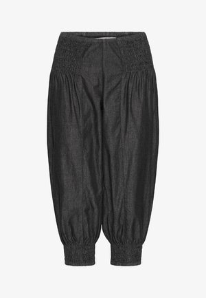 Mustad, kerge mustade pükste valik, millel on elastne vöö ja kogutud mansetid. Sile tekstuur ja vabav lõige koos peene sädelusega.