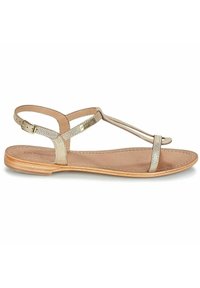 Guldmetalliska platta sandaler med t-remdesign, justerbar vristrem och en naturlig lädersula. Minimalistisk stil med en slät yta.