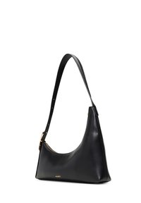 Black leather shoulder bag with a curved shape, a long adjustable strap, and subtle gold hardware accents. Features smooth texture and minimal branding.