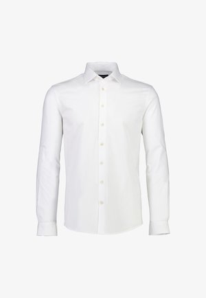 Witte blouse met lange mouwen van katoen, voorzien van een puntige kraag, knoopsluiting aan de voorkant en manchetten met één knoop. Glad, effen oppervlak.
