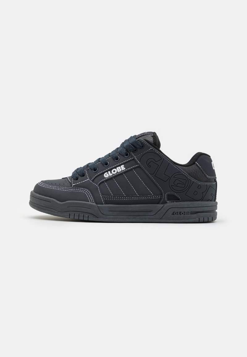 Black sneakers with a rubber sole, leather upper, padded collar, and white stitching. Features "GLOBE" logo on sides and tongue.