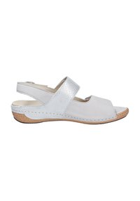 White leather sandal with an open toe, textured silver strap, and brown cork-like sole. Features a low heel and stitching detail.