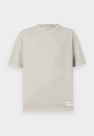 Light beige short-sleeve t-shirt made from soft fabric, featuring a round neckline and a small label at the bottom left.