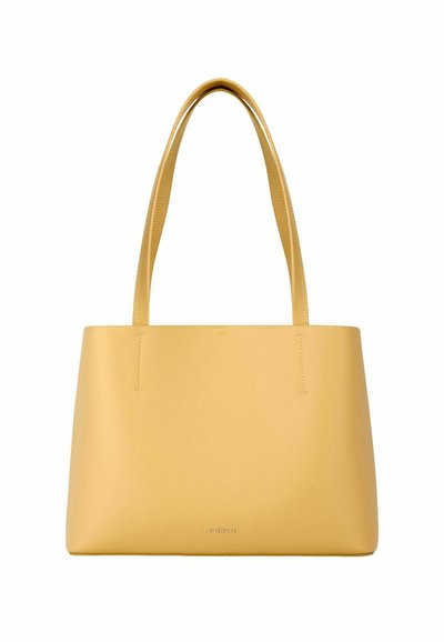 Rumena usnjena torba za nošenje na rami z dolgimi ročaji in subtilnim logotipom Cacharel na gladki zunanji površini.