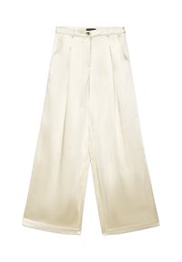 Pantalon à jambes larges en tissu lisse couleur crème clair. Caractérisé par des plis sur le devant, une fermeture à boutons et des poches latérales.