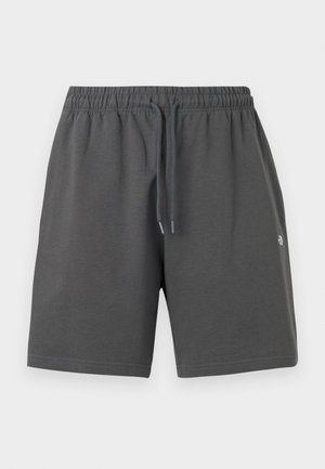 Grijze korte broek van zachte stof met een elastische tailleband en verstelbare trekkoord. Heeft een eenvoudig ontwerp zonder zakken of patronen.