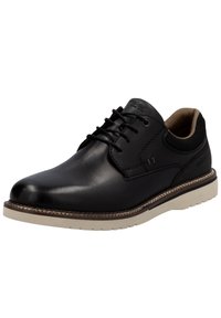 Scarpa in pelle nera con finitura liscia, design con lacci, suola in gomma beige e sottili dettagli di cucitura. L'interno presenta una fodera di un marrone chiaro.