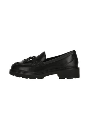 Mocassin en cuir noir avec détail pompon, semelle épaisse et design cousu, présenté de côté sur fond blanc.