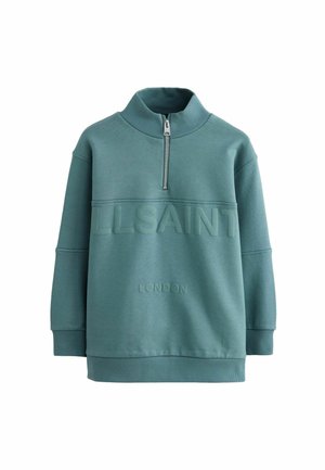 Vihreä huppari, jossa on korkea kaulus ja puolivetoketju, jossa on kohokuvioitu teksti "ALLSAINTS" ja "LONDON" rinnassa. Pehmeä tekstuuri.